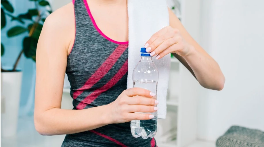 10 Best Strategies for Weight Loss Maintenance weight loss maintenance -a woman holding a bottle of water