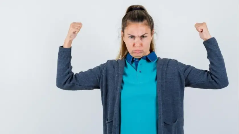 Common Challenges During Weight Loss Maintenance a woman with her arms up. Lack-of-Motivation